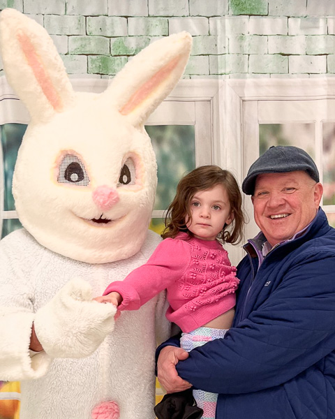 first selectman with his granddaughter and Easter bunny