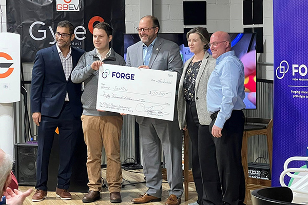 a group presenting a check