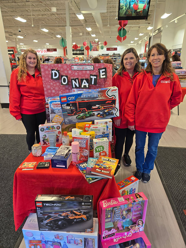 southbury helping hands volunteers at the gifts table