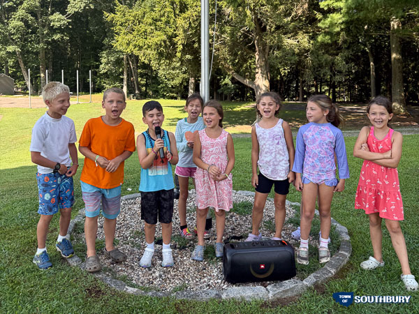 kids singing karaoke outside